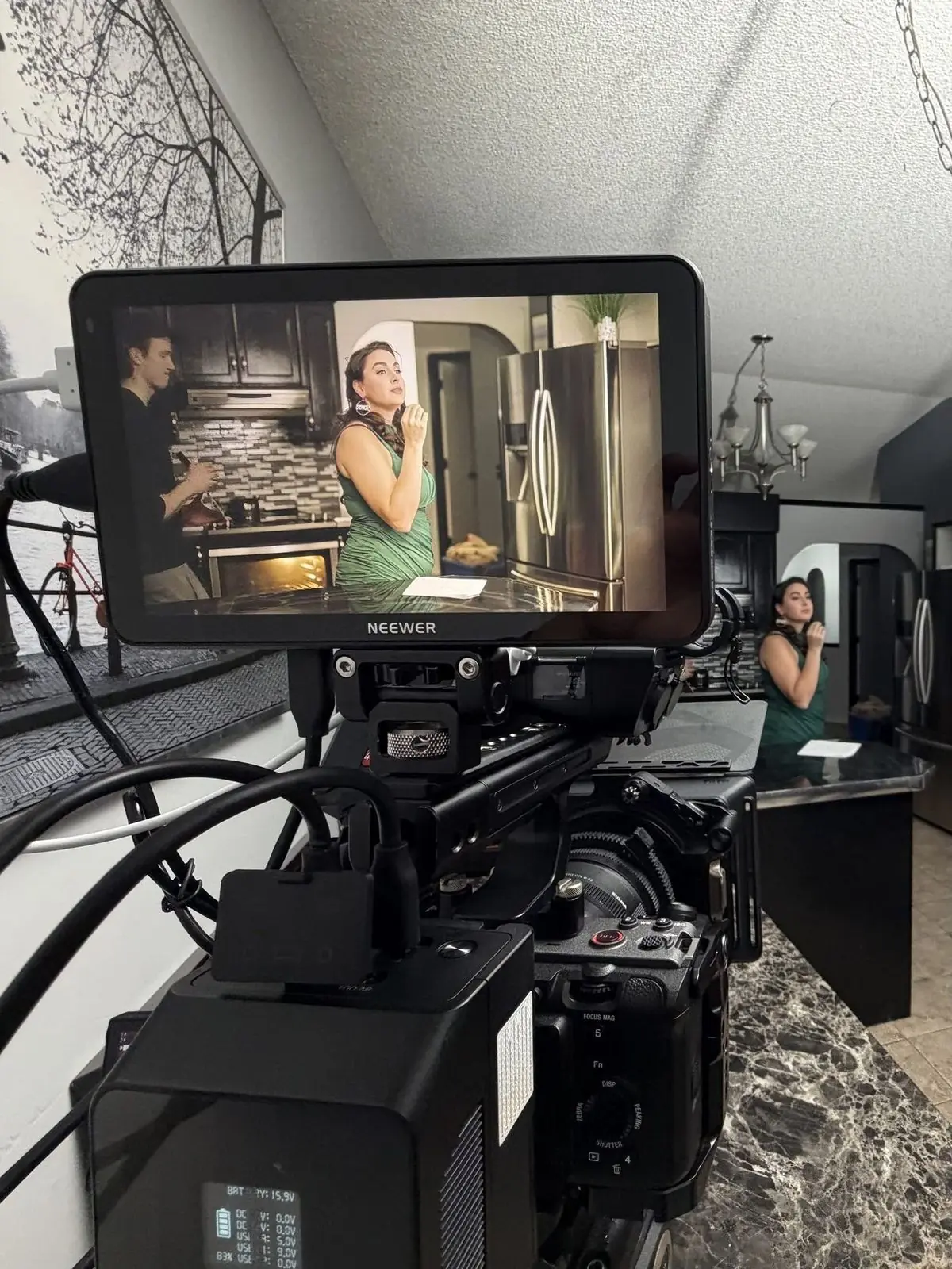 A vertical drama scene through the camera monitor on an ICAN set